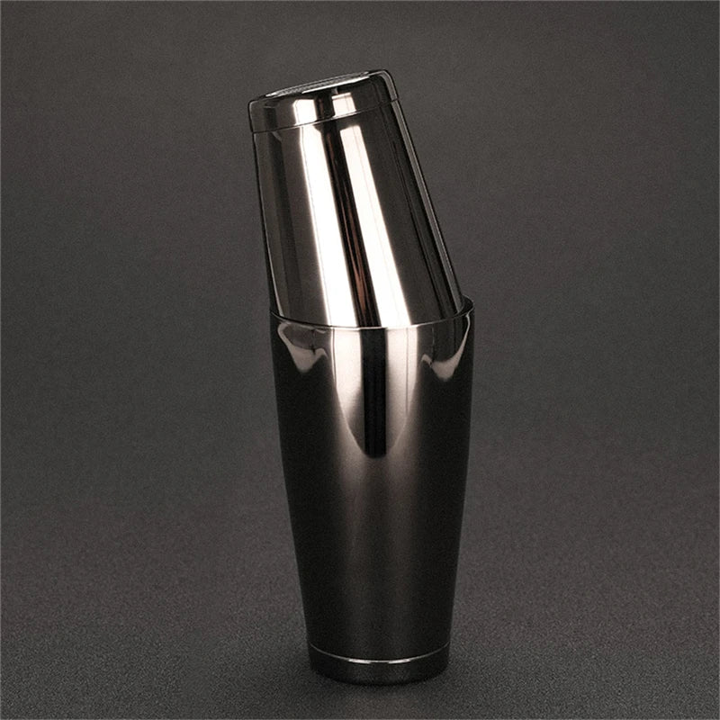 Stainless steel black shaker on a dark gray background
