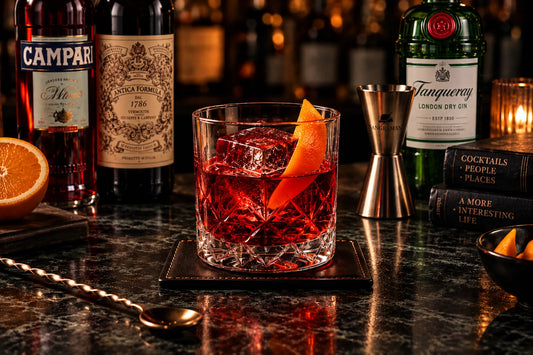 **Alt text:** `Negroni cocktail with gin, Campari and sweet vermouth, served over ice with an orange peel`