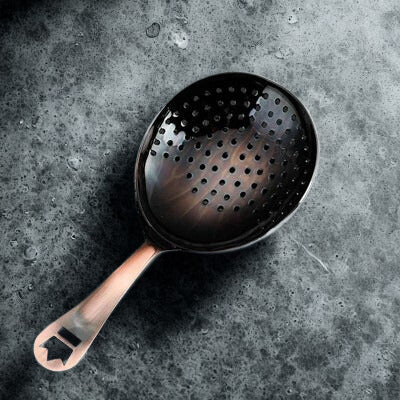 Bronze_cocktail_julep_strainer
