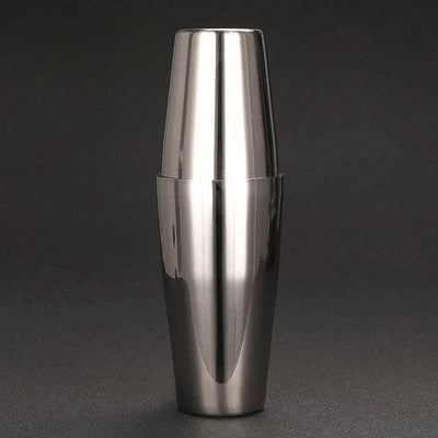 Stainless steel cocktail shaker on a dark background